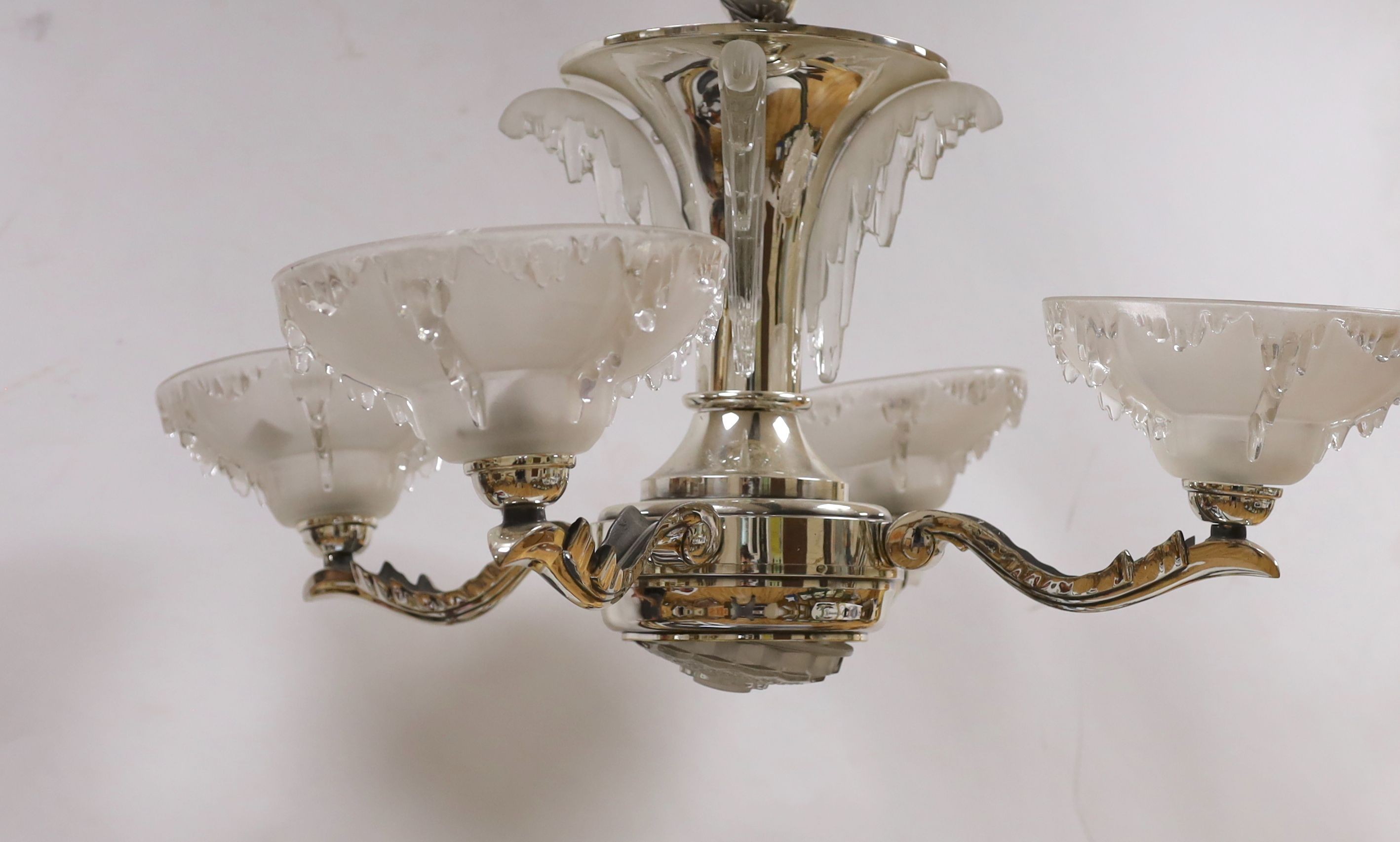 A chrome Art Deco 4 branch electrolier, with frosted glass shades, 77 cms high.